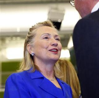 Secretary of State Hillary Clinton is greeted after arriving at a high-level meeting about the flood emergency in Pakistan, at the United Nations headquarters in New York September 19, 2010. REUTERS/Chip East