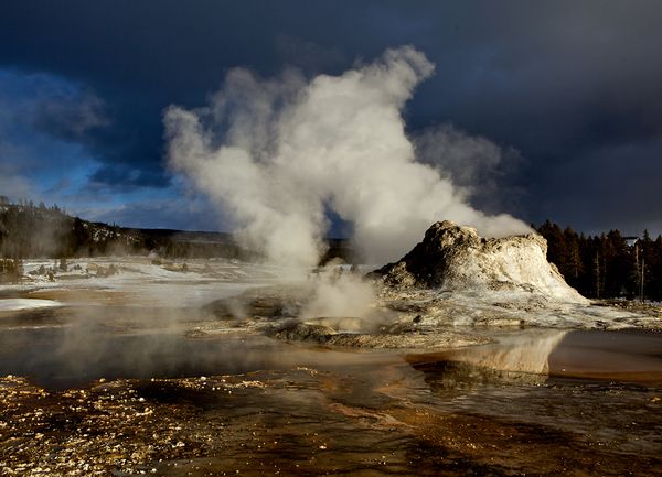 Steam rising from Castle Geyser in Yellowstone National Park.