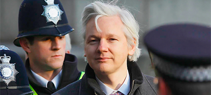 WikiLeaks founder Julian Assange awaits decision on his application for asylum as diplomatic row brews between UK and Ecuador. (photo: Kirsty Wigglesworth/AP)