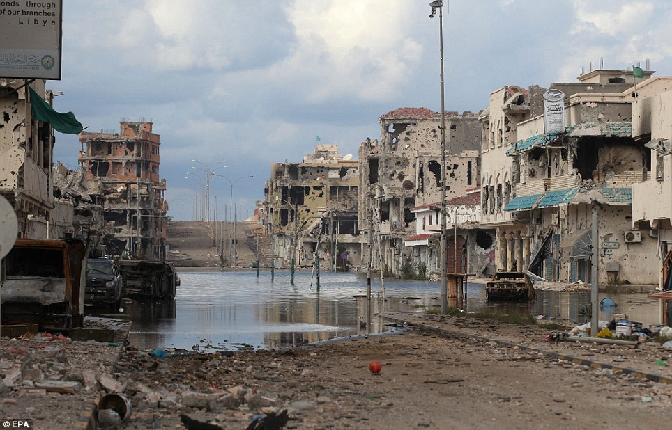 Deserted: The denuded buildings of Sirte will have to be demolished after they were pounded with heavy artillery for weeks