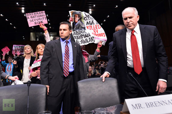 PHOTOS, VIDEO Protesters hold up hearing for Obama's CIA director nominee