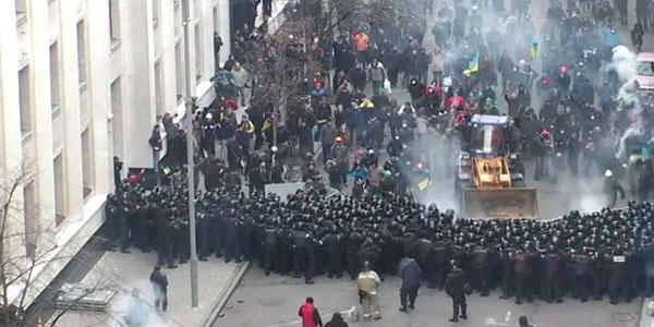 Ukraine Protesters Commandeer Bulldozer to Push Back Cops
