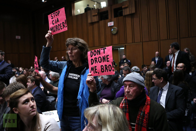 Anti-war protesters disrupt the start of a nomination hearing for U.S. Assistant to the President for Homeland Security and Counterterrorism John Brennan before the Senate Intelligence Committee February 7, 2013 in Washington, DC (AFP Photo / Win McNamee)