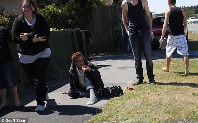 Frightened: Terrified residents took to the streets during the aftershocks to avoid being hit by possible falling debris