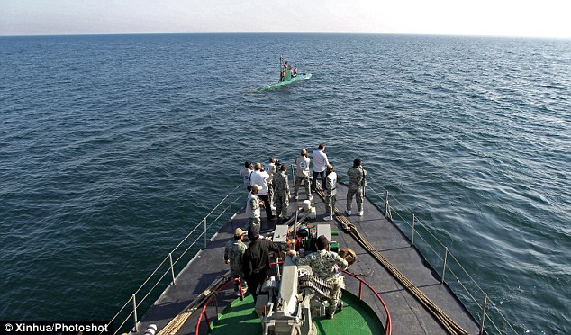 Lookout: A submarine performs naval maneuvers on the Sea of Oman during naval exercises in international waters