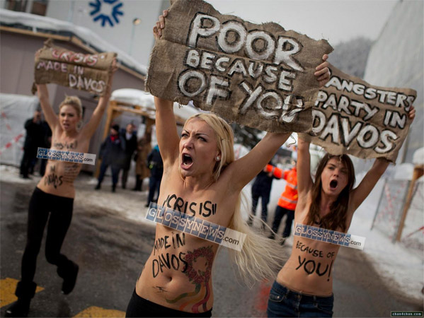 "THE MARCH OF THE SLUTS".  The bare-breasted Ukranian Femen group associated with the Pussy Riot girls. These decadent "artistes" like to make their point through sexual exhibitionism and religious blasphemypolitical tactics widely promoted and popularized by our Jew-controlled  Western media.