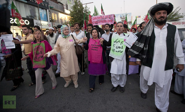 Peace activists from the U.S. and supporters of Pakistan Tehreek-e-Insaf (PTI) march as they protest against the drone attacks in the Pakistani tribal region at Islamabad October 5, 2012. (Reuters/Mian Khursheed)